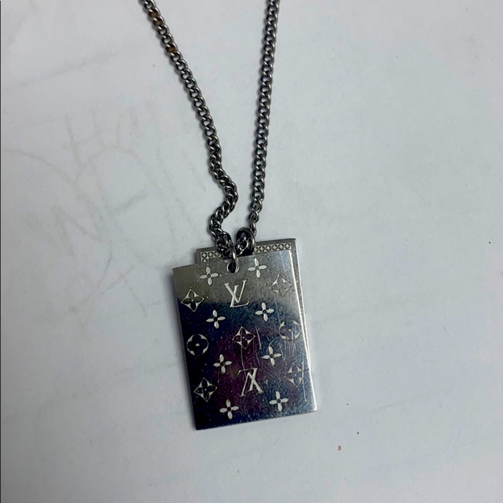 Louis Vuitton gently used authentic dog tags